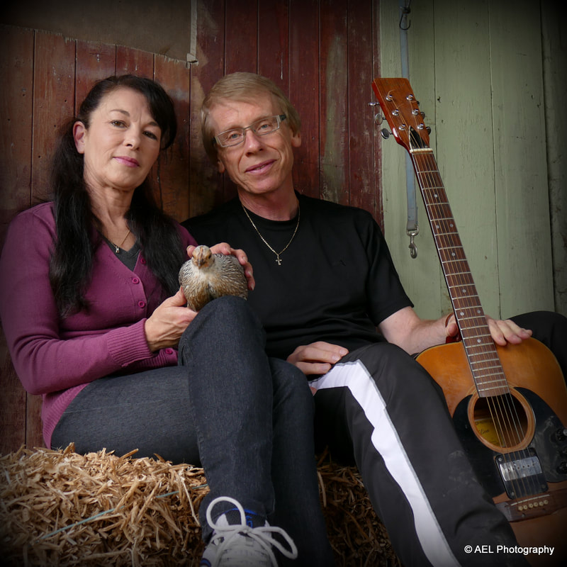 Keith Lightfoot from New Zealand relaxing in the barn with his guitar and beautiful wife
